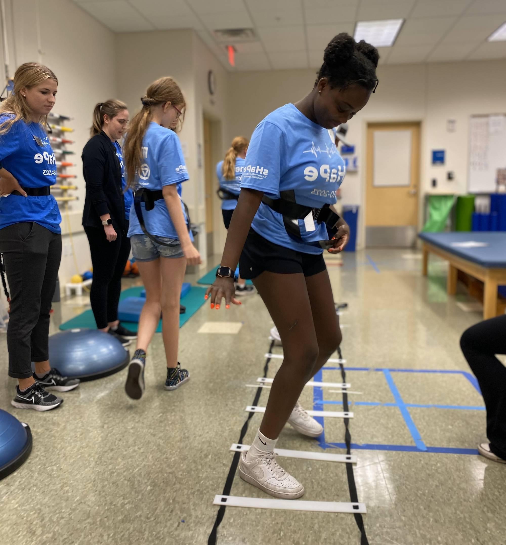 sHaPe camper using agility ladder